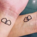 Tatuaggio di coppia con cuori intrecciati