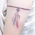 Tatuaggio bracciale cattura sogni sul braccio