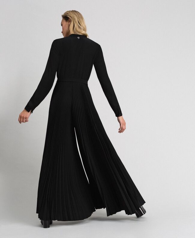 Tuta intera elegante con pantaloni palazzo plisse prezzo 235 euro Twinset